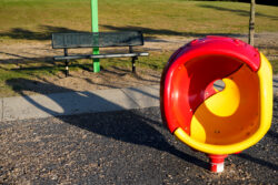 EMPTY BUDDY BENCH: Long shadows and a playground with no children creates a sense of loneliness.