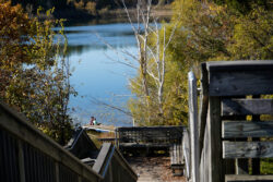 QUIET AFTERNOON: A mother and son share a quiet moment at the lake on an autumn afternoon.