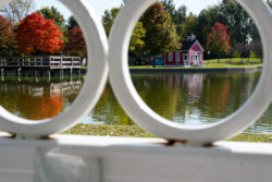 OLD SCHOOL HOUSE: A peekaboo effect of viewing an old school house through the framing of a gazebo.
