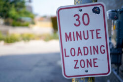 LOADING ZONE: Signage in an alley.